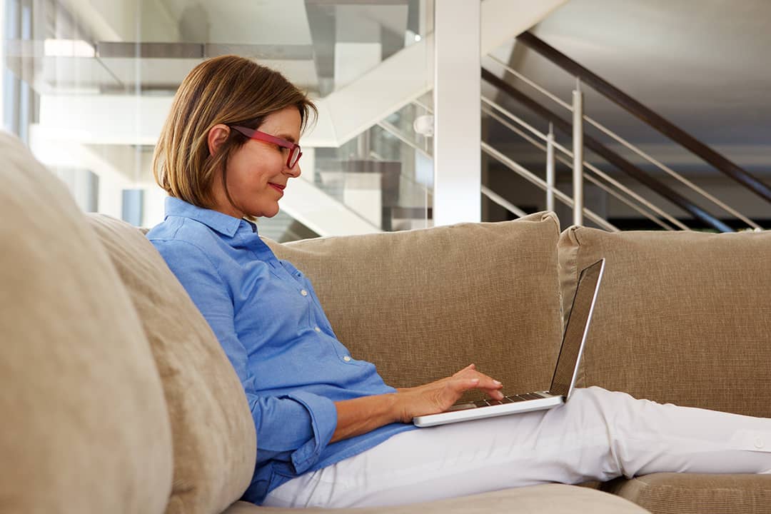 A businesswoman working at home with her laptop.